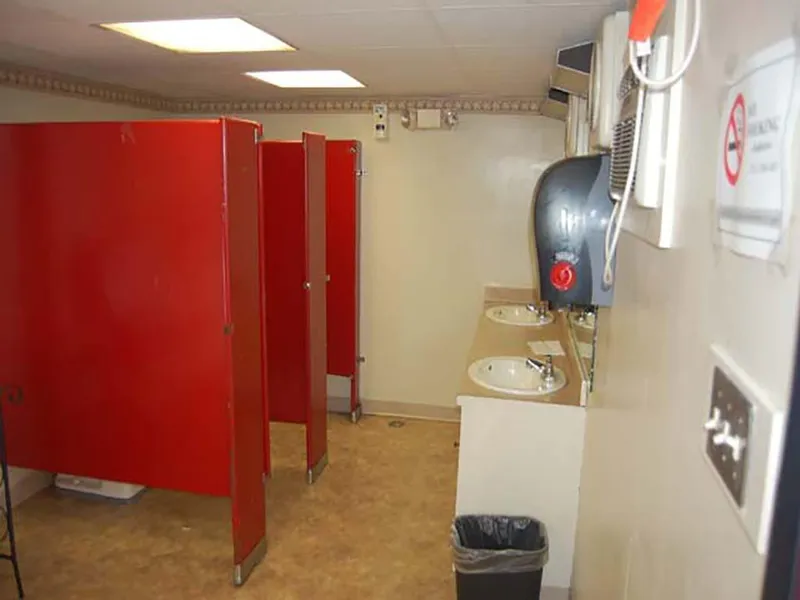 Slide: The Image of Public restroom with red stalls and sinks on a 1985 Custom Serodino Dinner Boat. - 22