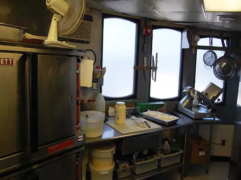 Slide: The Image of Kitchen interior of 1985 Custom Serodino Dinner Boat with cooking equipment and supplies. - 25