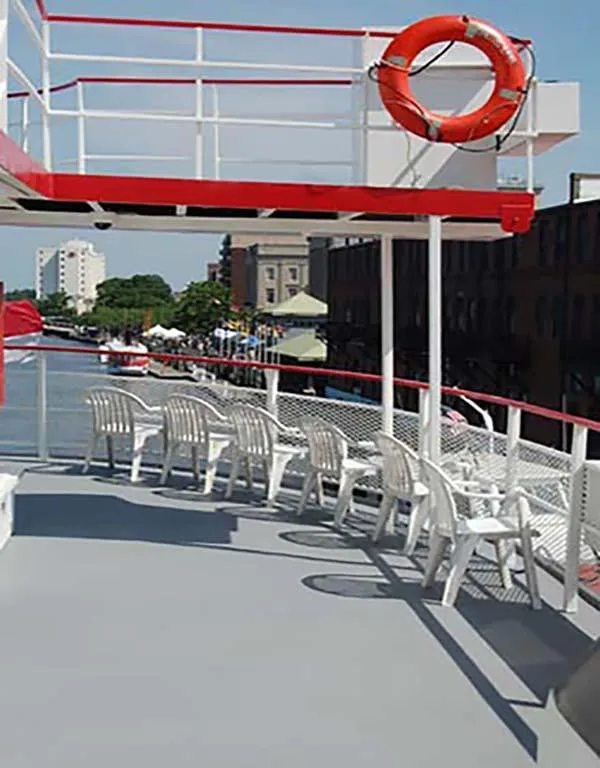 Slide: The Image of Upper deck of 1985 Custom Serodino Dinner Boat with chairs and lifebuoy. - 9