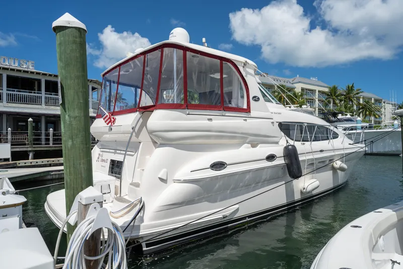 The Image of 2003 Sea Ray 480 Motor Yacht docked at marina under blue sky. - 0