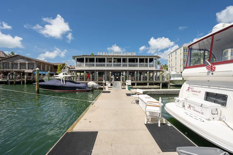 Slide: The Image of Docked boats at a marina with a 2003 Sea Ray 480 Motor Yacht, sunny day. - 10
