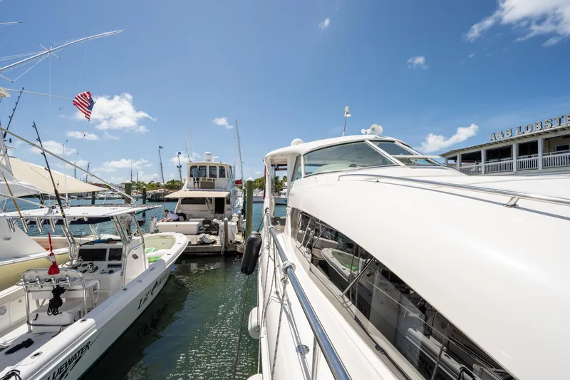Slide: The Image of 2003 Sea Ray 480 Motor Yacht docked at marina under clear blue sky. - 16