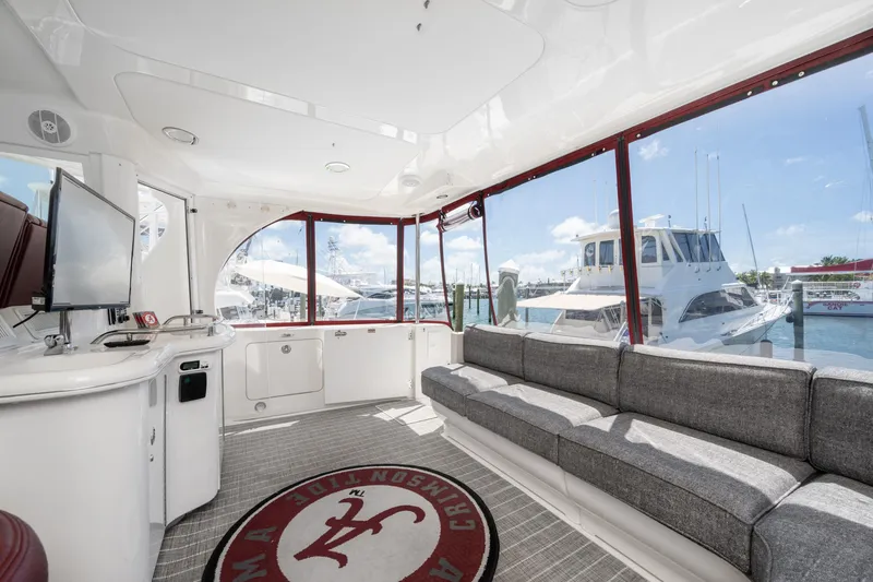 Slide: The Image of Luxurious interior of 2003 Sea Ray 480 Motor Yacht with spacious seating and marina view. - 19