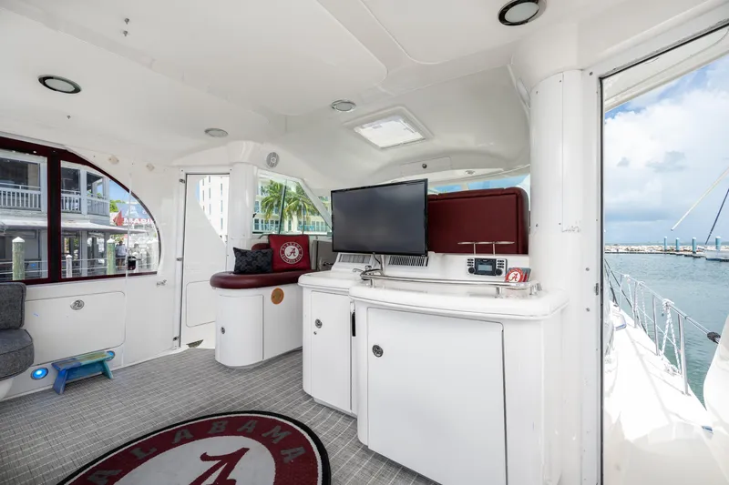 Slide: The Image of Interior of 2003 Sea Ray 480 Motor Yacht with TV and seating area. - 23