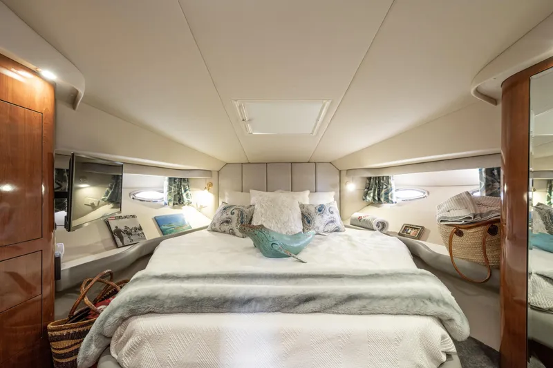 Slide: The Image of Luxurious 2003 Sea Ray 480 Motor Yacht bedroom with elegant decor and cozy bedding. - 36