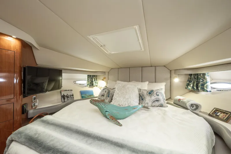 Slide: The Image of Luxurious 2003 Sea Ray 480 Motor Yacht bedroom with elegant decor and modern amenities. - 37