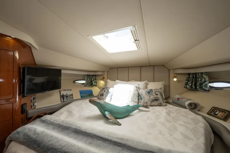 Slide: The Image of Luxurious 2003 Sea Ray 480 Motor Yacht bedroom with elegant decor and natural light. - 38
