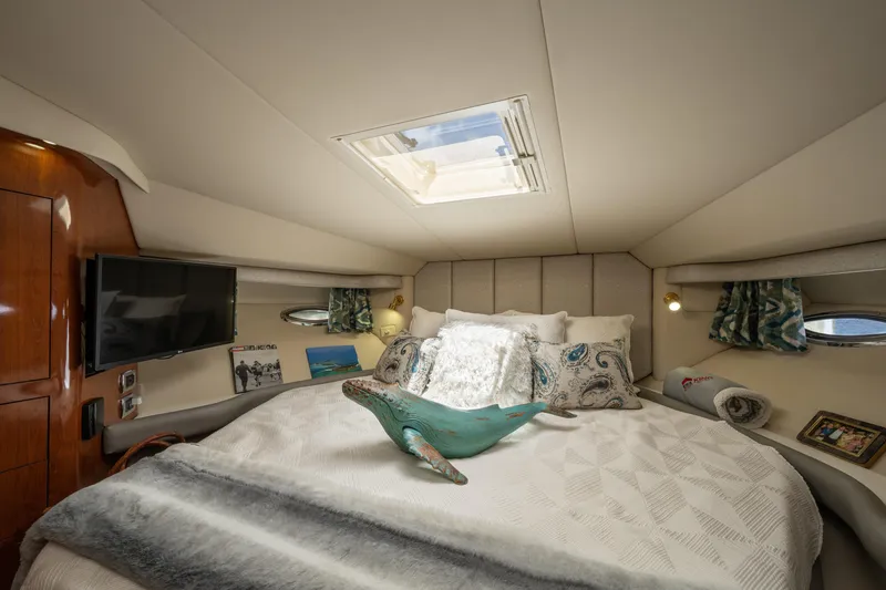 Slide: The Image of Luxurious bedroom interior of 2003 Sea Ray 480 Motor Yacht with skylight and elegant decor. - 39