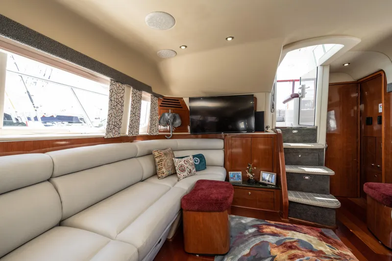 Slide: The Image of Luxurious interior of 2003 Sea Ray 480 Motor Yacht with plush seating and modern decor. - 46