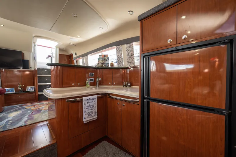 Slide: The Image of Luxurious interior of 2003 Sea Ray 480 Motor Yacht with modern kitchen amenities. - 49
