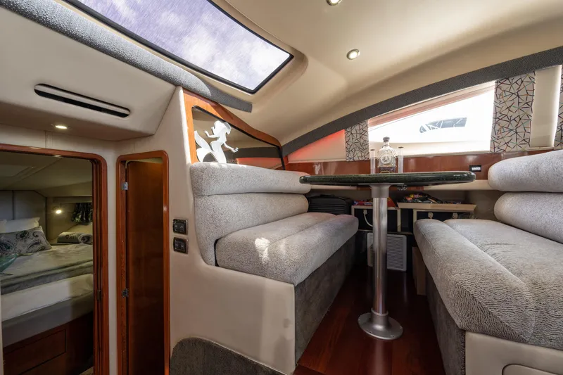 Slide: The Image of Luxurious interior of a 2003 Sea Ray 480 Motor Yacht with plush seating and elegant decor. - 54