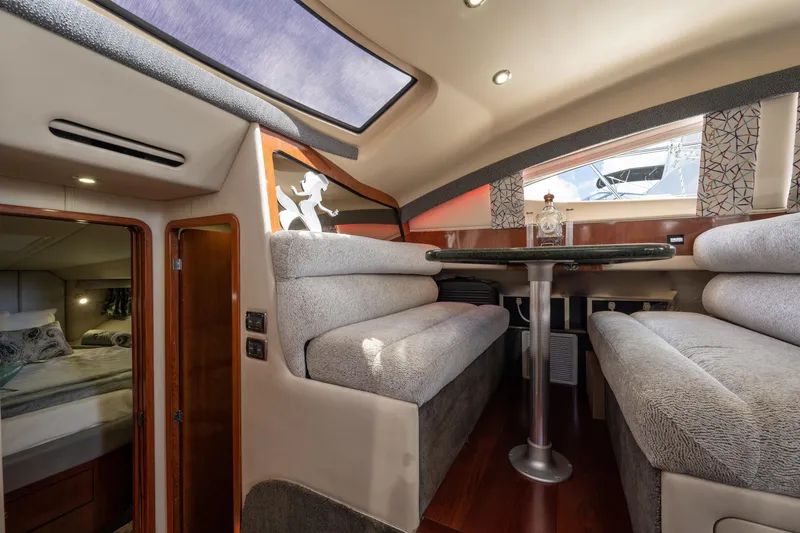 Slide: The Image of Luxurious interior of 2003 Sea Ray 480 Motor Yacht with plush seating and elegant decor. - 56