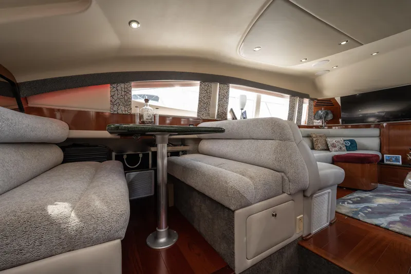 Slide: The Image of Luxurious interior of 2003 Sea Ray 480 Motor Yacht with plush seating and elegant decor. - 57