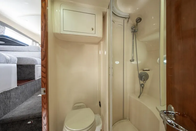 Slide: The Image of 2003 Sea Ray 480 Motor Yacht bathroom with shower and toilet. - 58