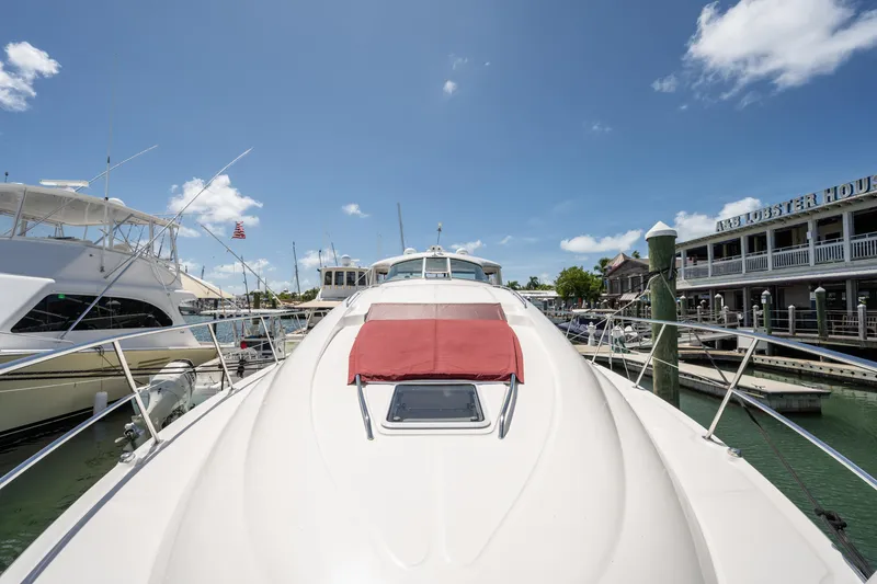 Slide: The Image of 2003 Sea Ray 480 Motor Yacht docked at marina under clear blue sky. - 9