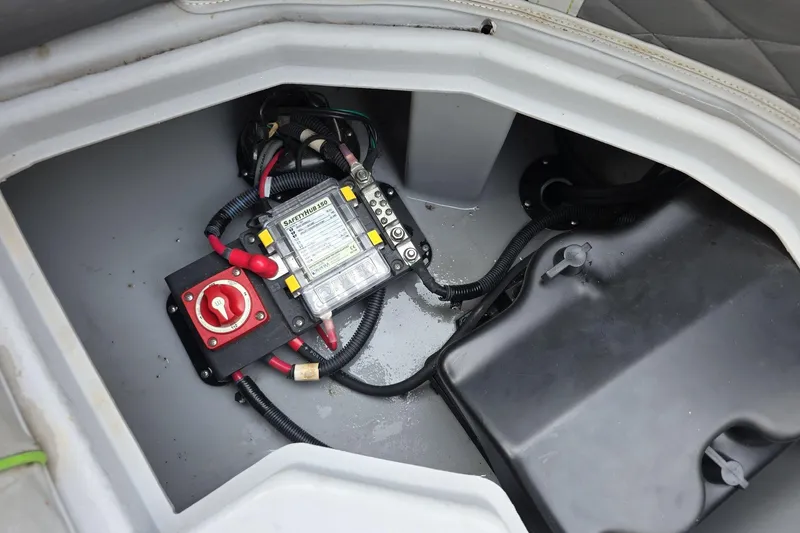 Slide: The Image of Electrical components inside a 2021 Bennington LX 24 Quad Bench boat compartment. - 13