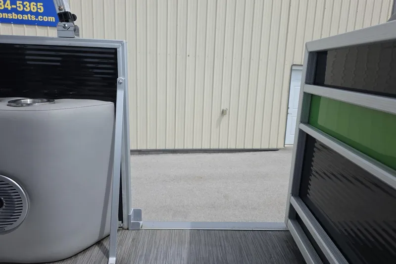 Slide: The Image of 2021 Bennington LX 24 Quad Bench interior view with speaker and railing. - 14