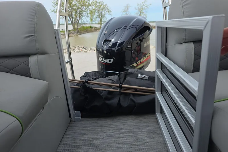 Slide: The Image of 2021 Bennington LX 24 Quad Bench interior with Yamaha 250 engine in background. - 15