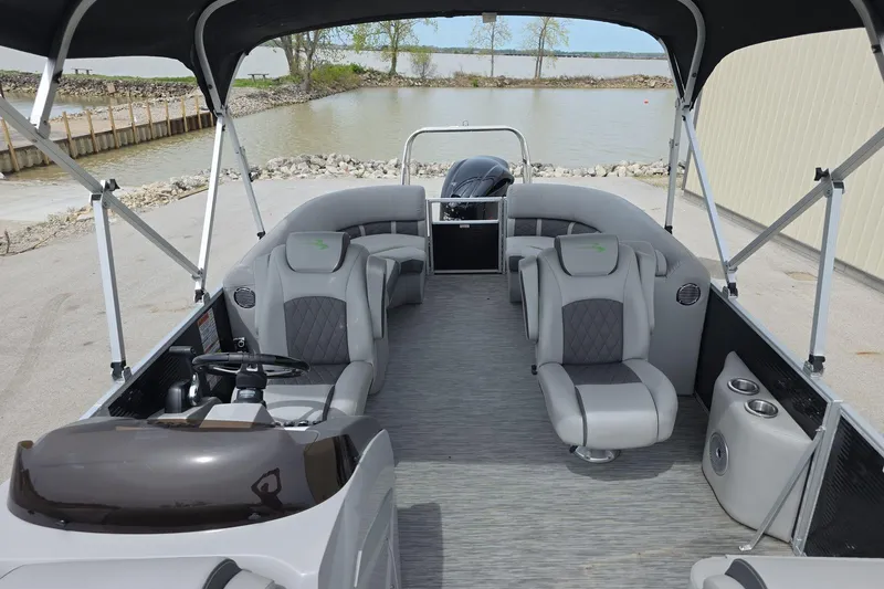 Slide: The Image of 2021 Bennington LX 24 Quad Bench pontoon boat with spacious seating and sleek design. - 18