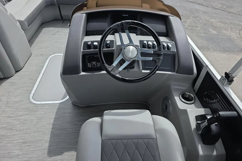 Slide: The Image of Cockpit of 2021 Bennington LX 24 Quad Bench with modern steering and controls. - 7