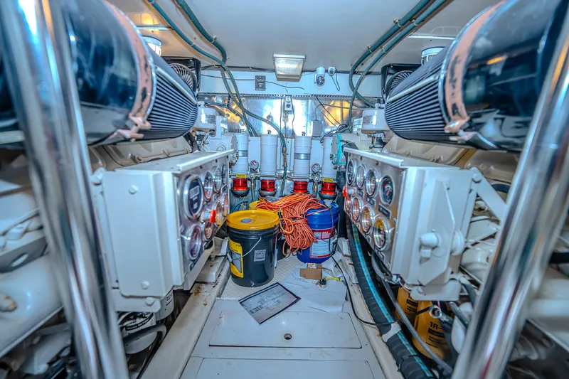 Slide: The Image of Engine room of 1997 Ocean Yachts 60 Super Sport EB, featuring gauges and equipment. - 22