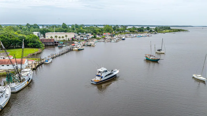 Slide: The Image of Aerial view of 1997 Ocean Yachts 60 Super Sport EB in a marina setting. - 23