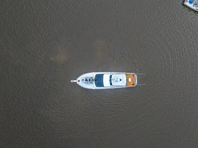 Slide: The Image of Aerial view of 1997 Ocean Yachts 60 Super Sport EB on calm water. - 27