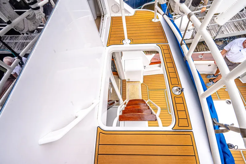 Slide: The Image of 1997 Ocean Yachts 60 Super Sport EB, teak deck, white railing, docked. - 5