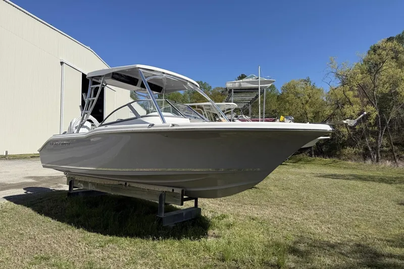 The Image of 2026 Key West 239 DFS boat on display outdoors near a large building. - 0