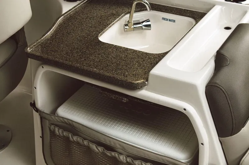 Slide: The Image of Manufacturer Provided Image: Key West 239 DFS 2026 boat kitchenette with sink and storage. - 10