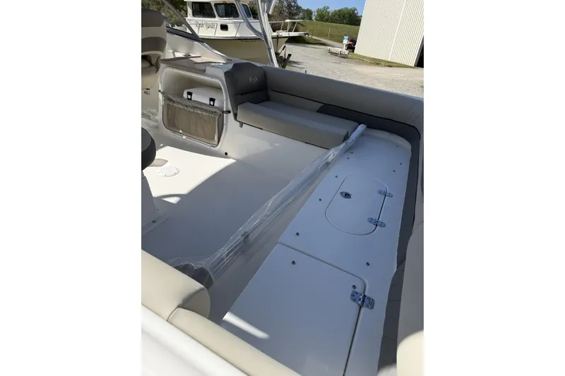Slide: The Image of Interior view of 2026 Key West 239 DFS boat, showcasing seating and storage compartments. - 2