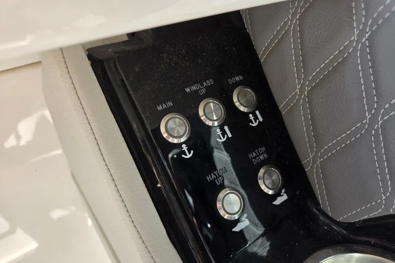 Slide: The Image of Control panel of 2022 Sea Ray SLX 280 boat with anchor and hatch buttons. - 13