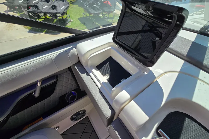 Slide: The Image of Interior view of 2022 Sea Ray SLX 280 boat with open storage compartment. - 18