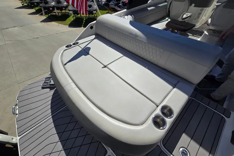 Slide: The Image of 2022 Sea Ray SLX 280 boat with luxurious seating and cup holders on deck. - 19