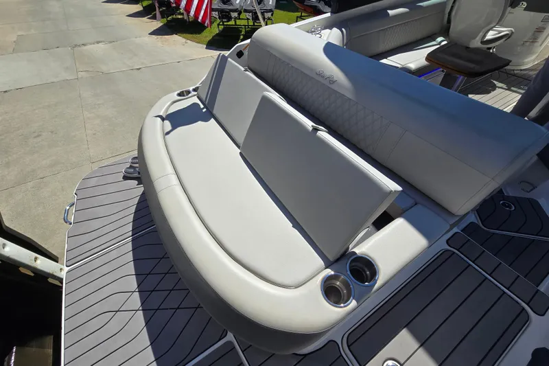 Slide: The Image of 2022 Sea Ray SLX 280 boat with luxurious seating and cup holders on deck. - 20