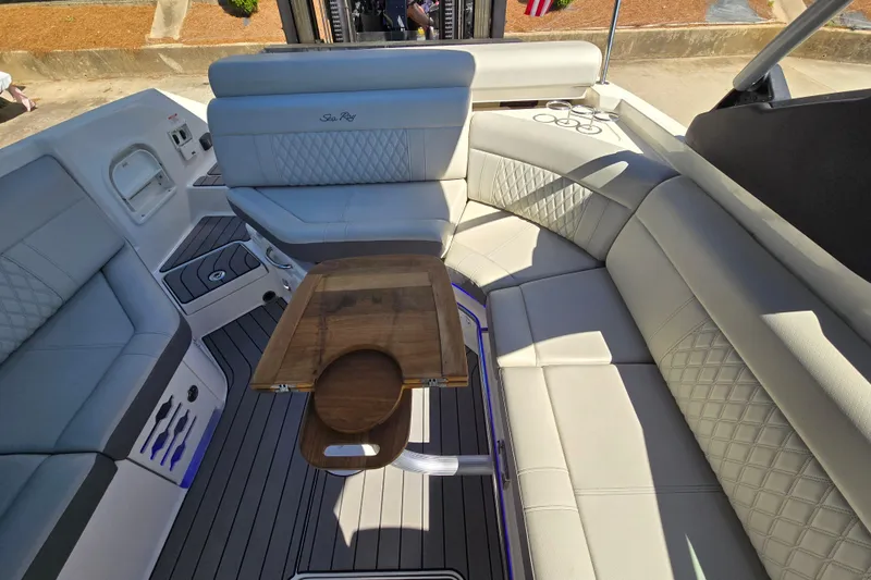Slide: The Image of Luxurious interior of 2022 Sea Ray SLX 280 boat with elegant seating and wooden table. - 24