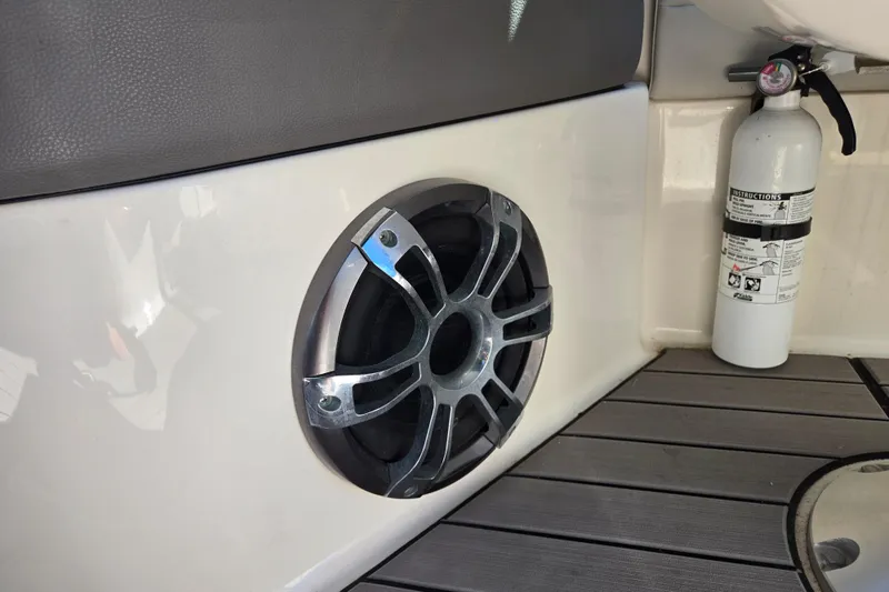 Slide: The Image of Speaker and fire extinguisher on 2022 Sea Ray SLX 280 boat deck. - 26