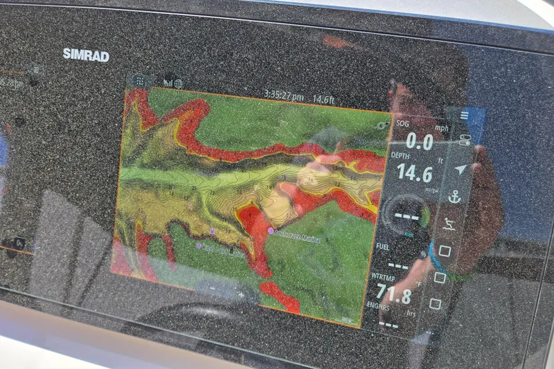 Slide: The Image of Simrad navigation display on 2022 Sea Ray SLX 280 showing depth and map details. - 30