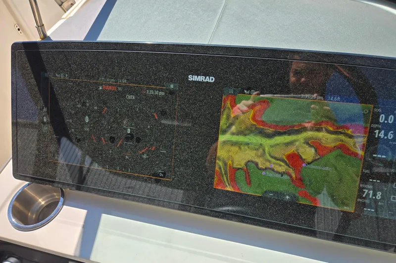 Slide: The Image of Simrad navigation display on 2022 Sea Ray SLX 280 boat dashboard. - 31