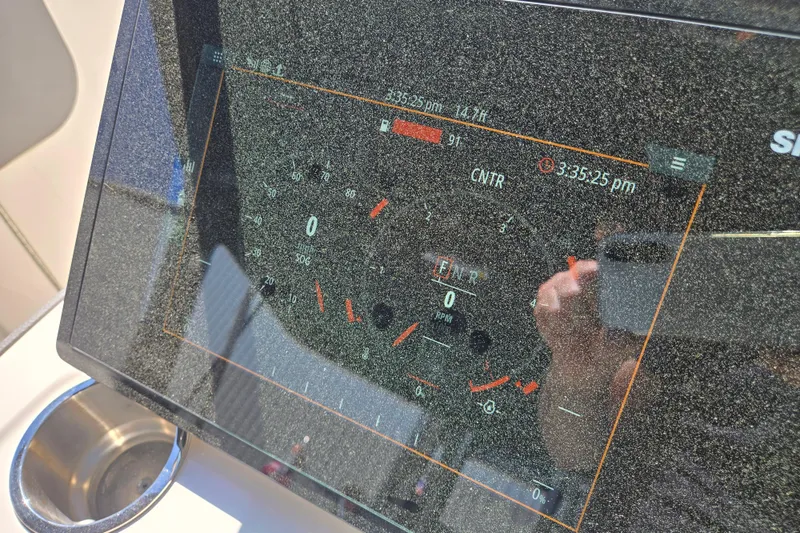 Slide: The Image of Dashboard display of a 2022 Sea Ray SLX 280 boat, showing speed and RPM gauges. - 34