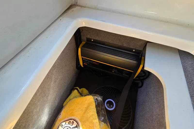 Slide: The Image of Storage compartment in a 2022 Sea Ray SLX 280 boat with ProSportHD charger. - 45
