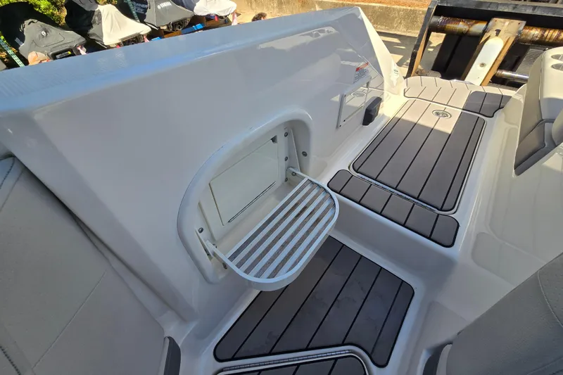 Slide: The Image of 2022 Sea Ray SLX 280 boat interior with sleek seating and modern design. - 47