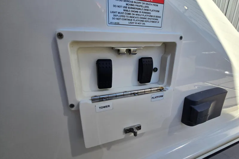Slide: The Image of Control panel on 2022 Sea Ray SLX 280 boat with tower and platform switches. - 49