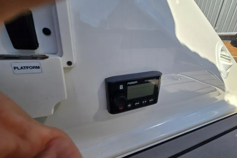 Slide: The Image of Control panel on a 2022 Sea Ray SLX 280 boat, featuring Fusion MS-RA70N stereo system. - 50