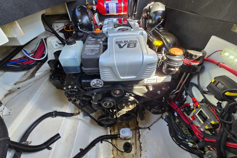 Slide: The Image of Engine compartment of a 2022 Sea Ray SLX 280 with a Big Block V8 engine. - 58