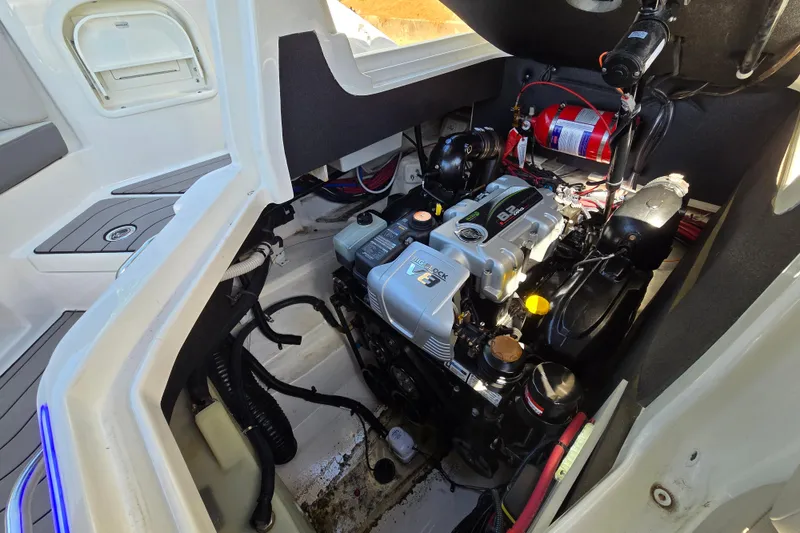 Slide: The Image of Engine compartment of a 2022 Sea Ray SLX 280 boat, showcasing the engine and components. - 59