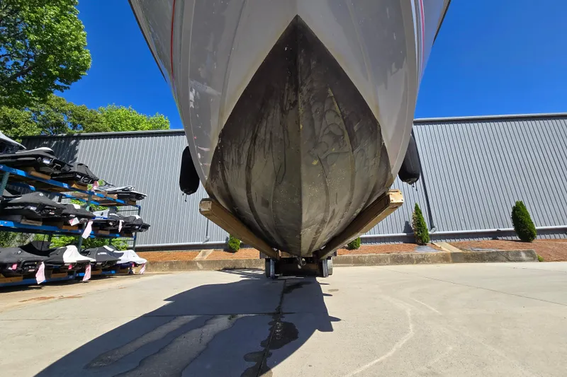 Slide: The Image of 2022 Sea Ray SLX 280 boat hull on trailer, outdoor storage facility. - 6