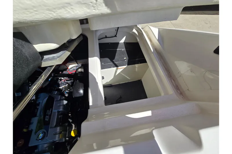 Slide: The Image of Engine compartment of a 2022 Sea Ray SLX 280 boat, showcasing interior details. - 60