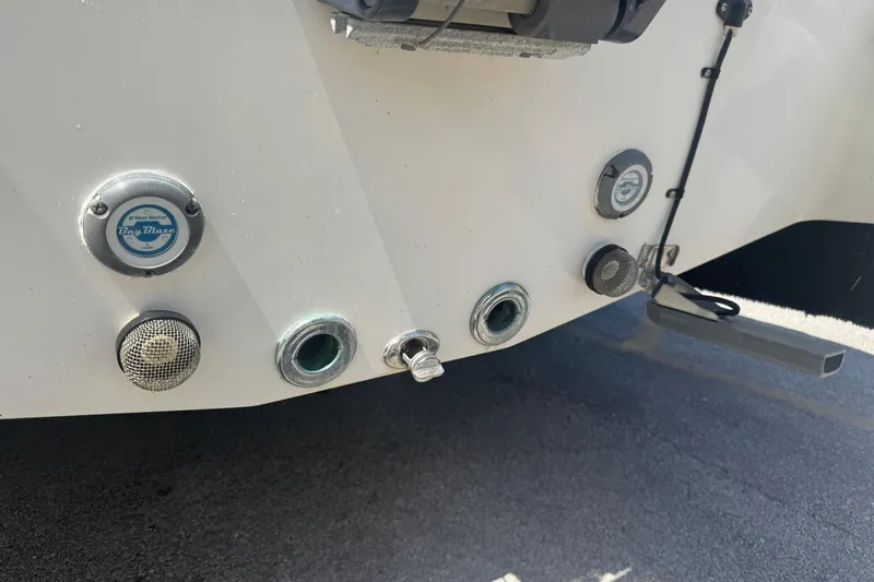 Slide: The Image of 2017 NauticStar 211 Angler boat stern with various fittings and fixtures. - 18