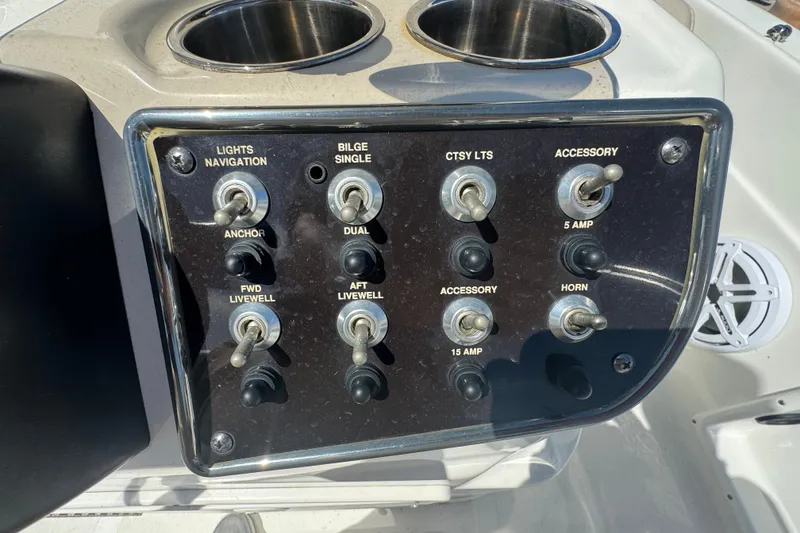 Slide: The Image of Control panel of a 2017 NauticStar 211 Angler boat with labeled switches. - 5